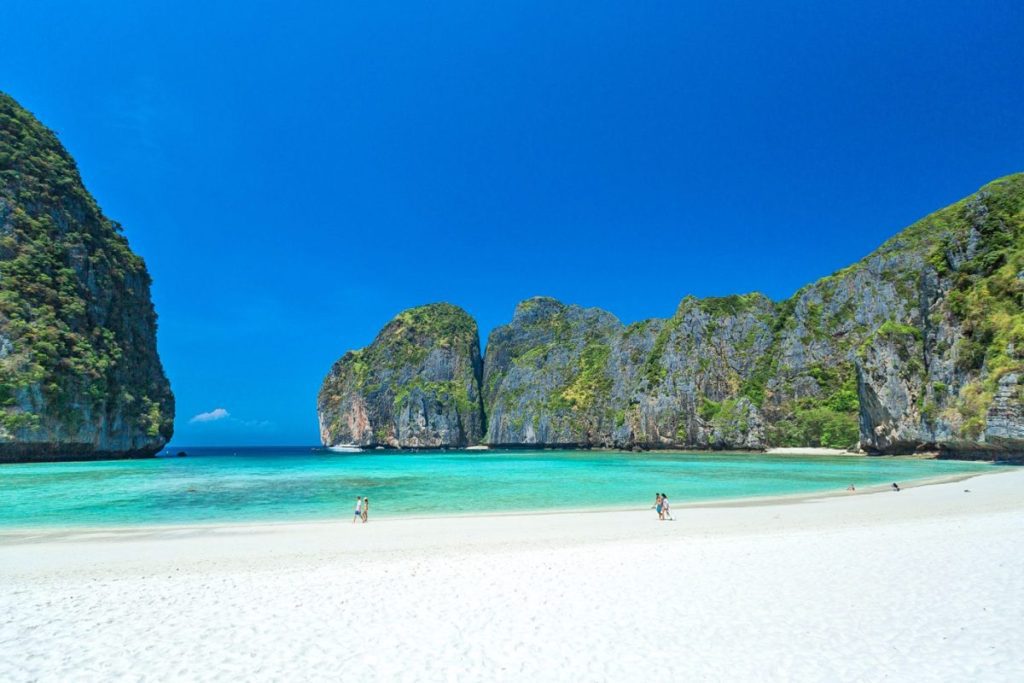 White sand, clear turquoise water and high limestone cliffs at Maya Bay in the Phi Phi Islands